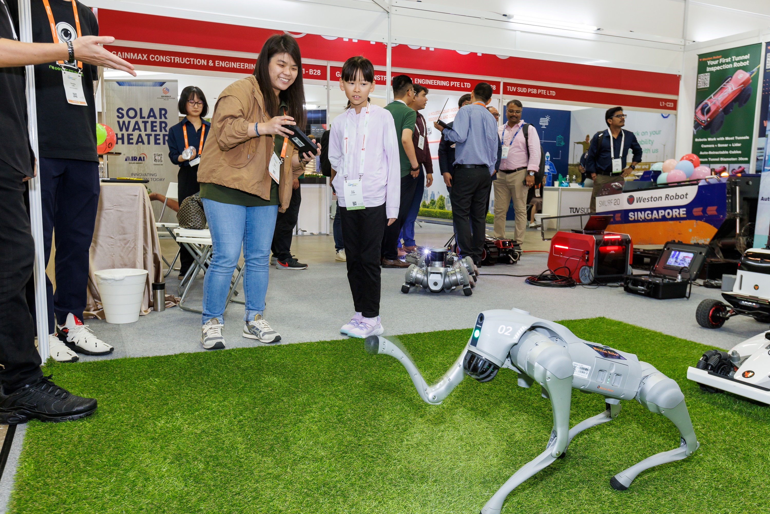 Demonstrating robotic dog capabilities to the Chairman of Certis and other leaders..jpg